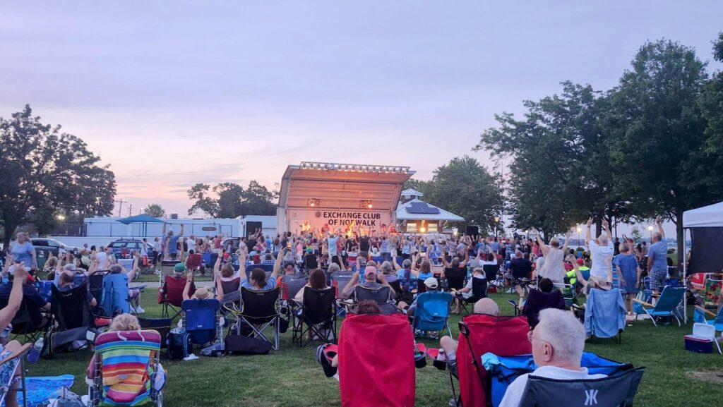 People of all ages gathered for an evening concert by the Norwalk Exchange Club at Calf Pasture Beach. 